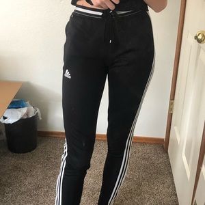Black and white striped Adidas sweat pants.